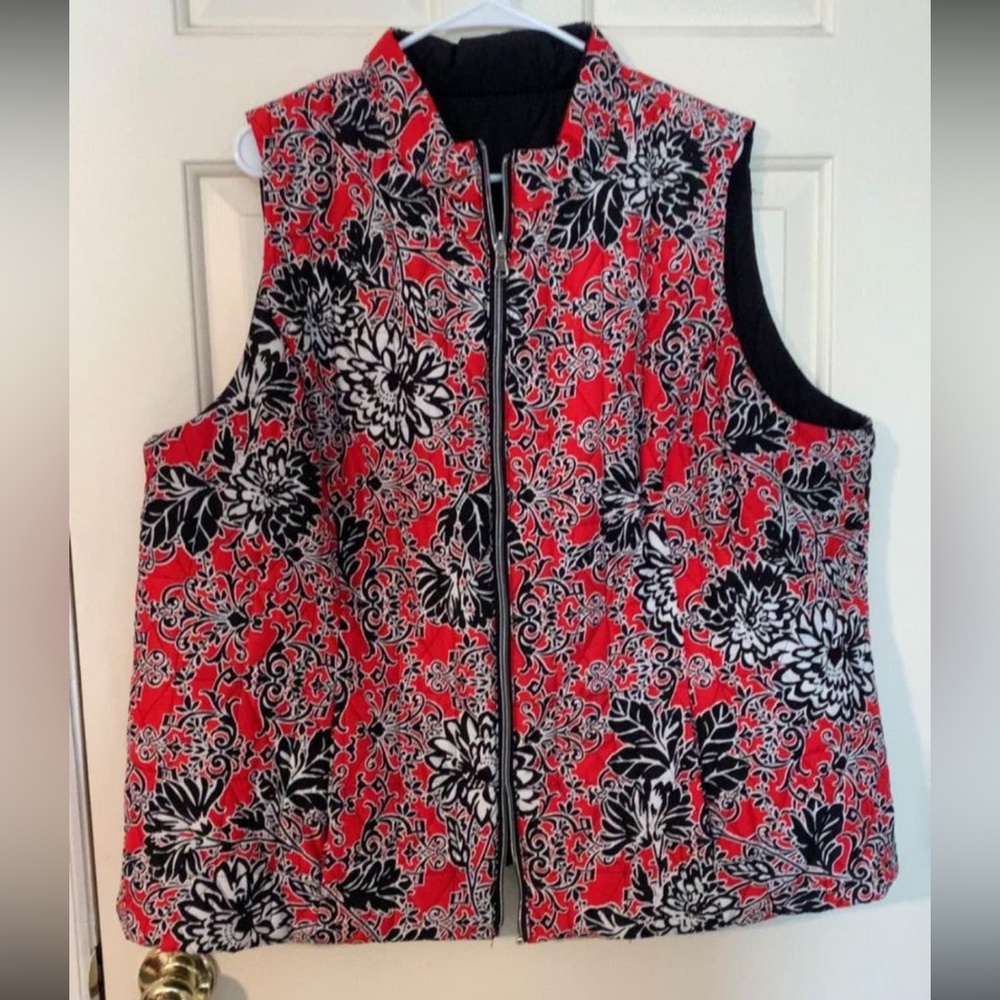 Reversible- red & black floral print one side- solid black other side- zips